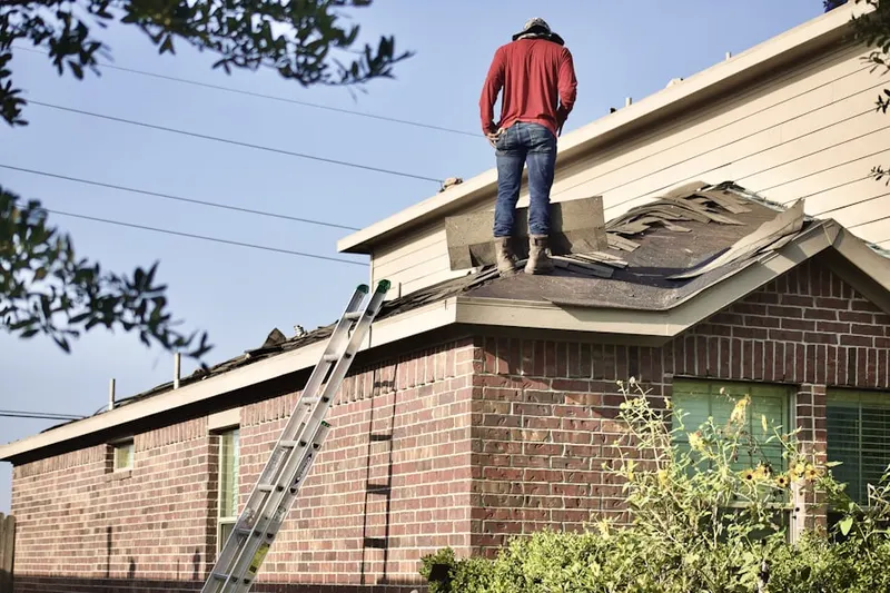 Professional roofer working on a residential roof in Merriweather